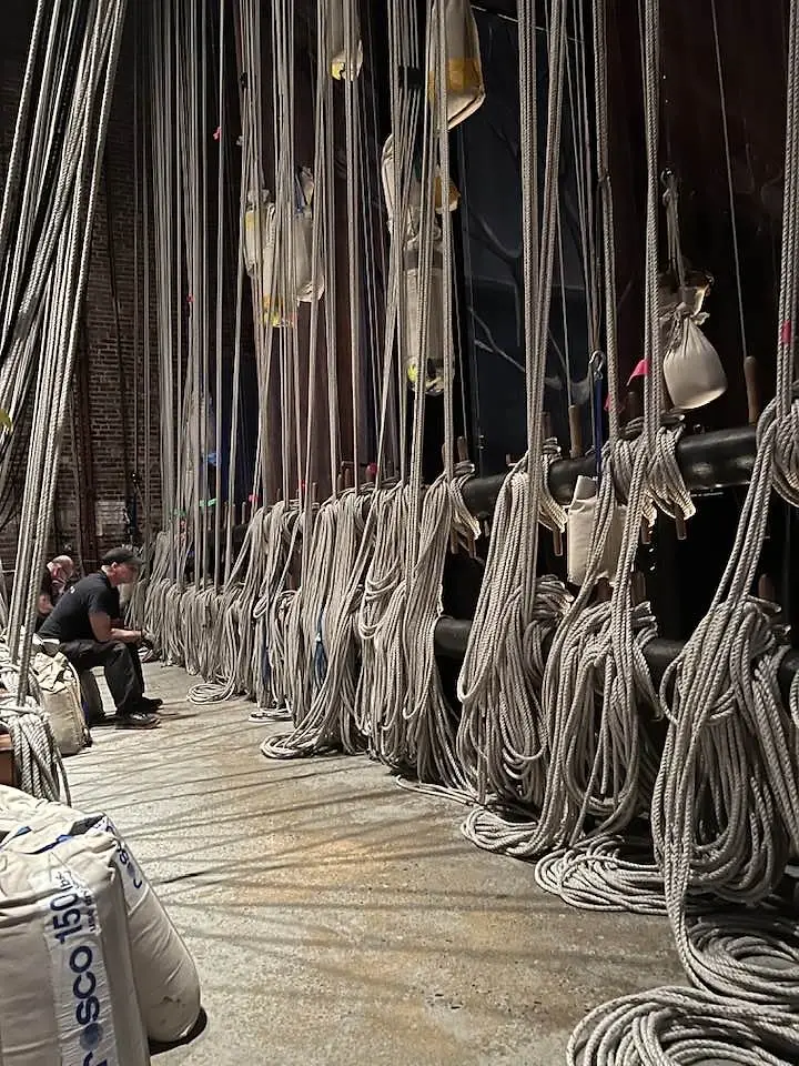 Fly tower lines backstage in a working venue